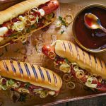 Hot dosg con cebolla frita